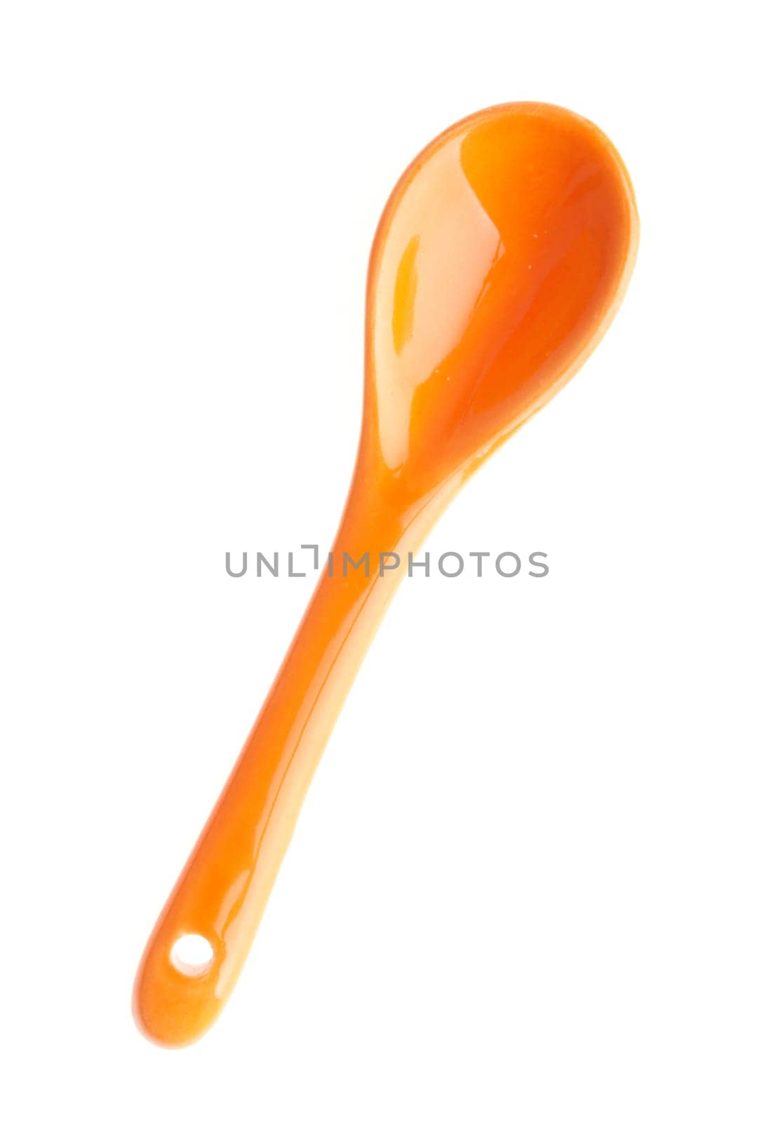 orange porcelain spoon isolated on white background
