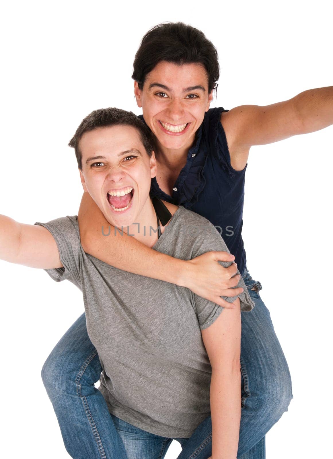 happy smiling sisters having fun celebrating something, playing piggyback (isolated on white background)