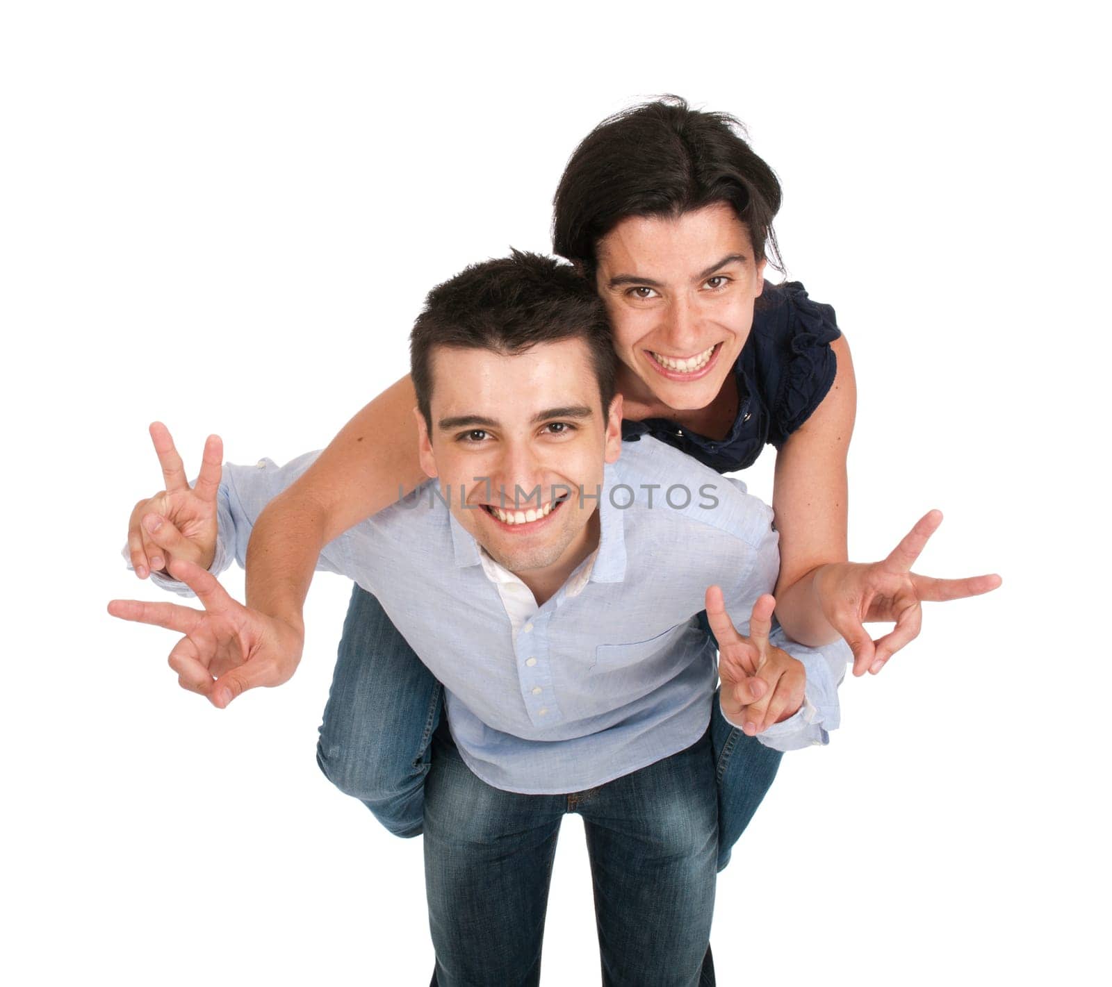 happy smiling brother and sister showing victory hand sign while playing together piggyback, isolated on white background