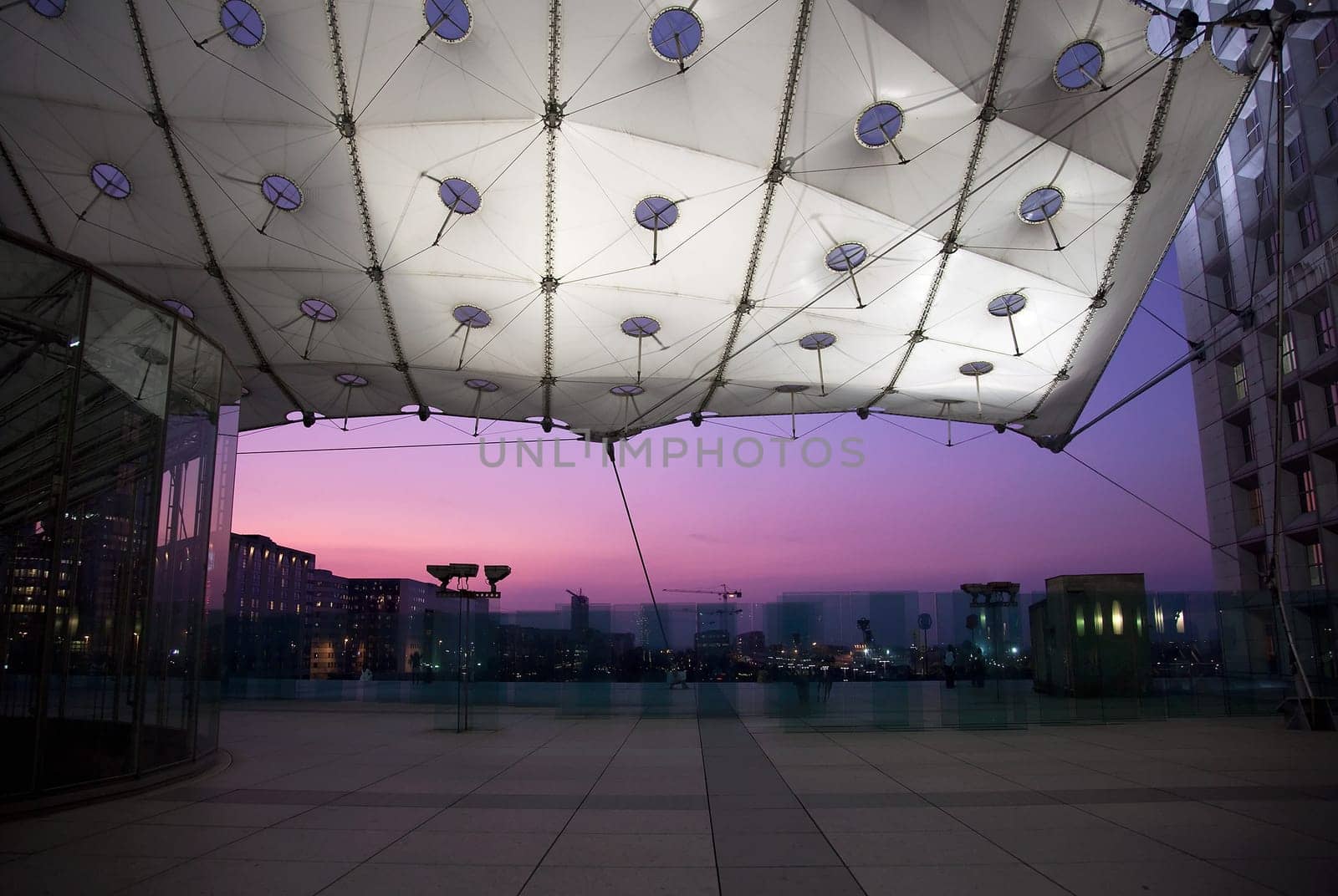 PARIS - SEPTEMBER 21: La Grande Arche in Paris at sunset. La Grande Arche is 110m high and was inagurated in July 1989