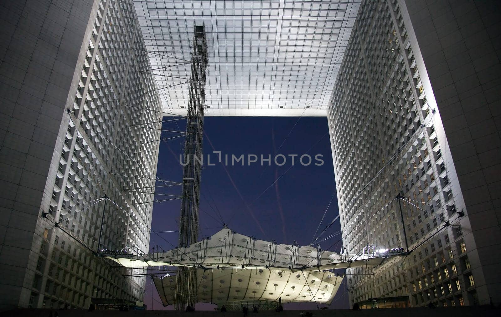 PARIS - SEPTEMBER 21: La Grande Arche in Paris at sunset. La Grande Arche is 110m high and was inagurated in July 1989
