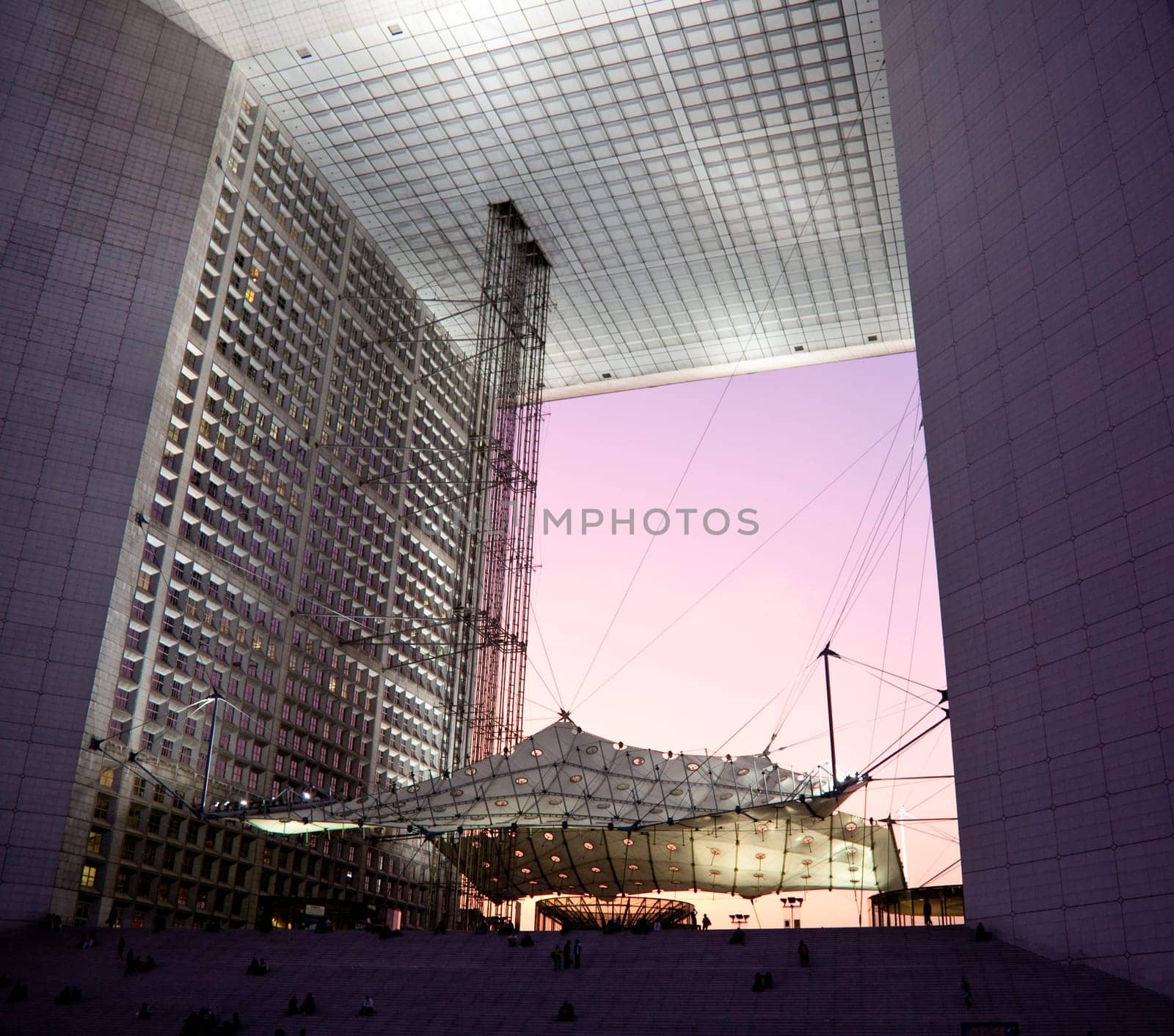 PARIS - SEPTEMBER 21: La Grande Arche in Paris at sunset. La Grande Arche is 110m high and was inagurated in July 1989