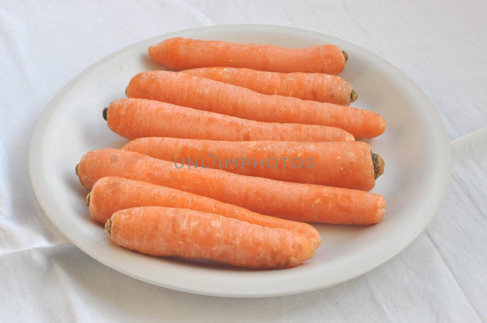 Orange carrot slices useful as a background
