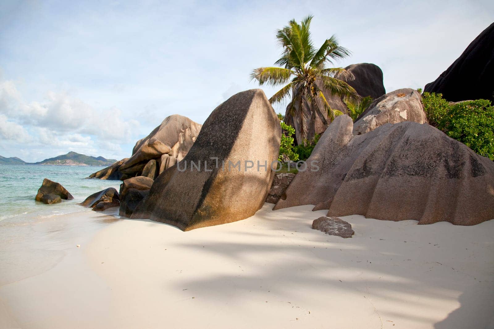Paradise beach with white sand and rocks - horizontal