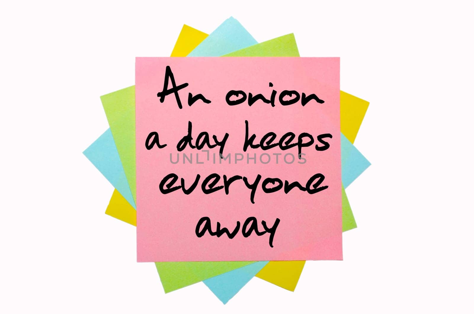 text "An onion a day keeps everyone away"" written by hand font on bunch of colored sticky notes"