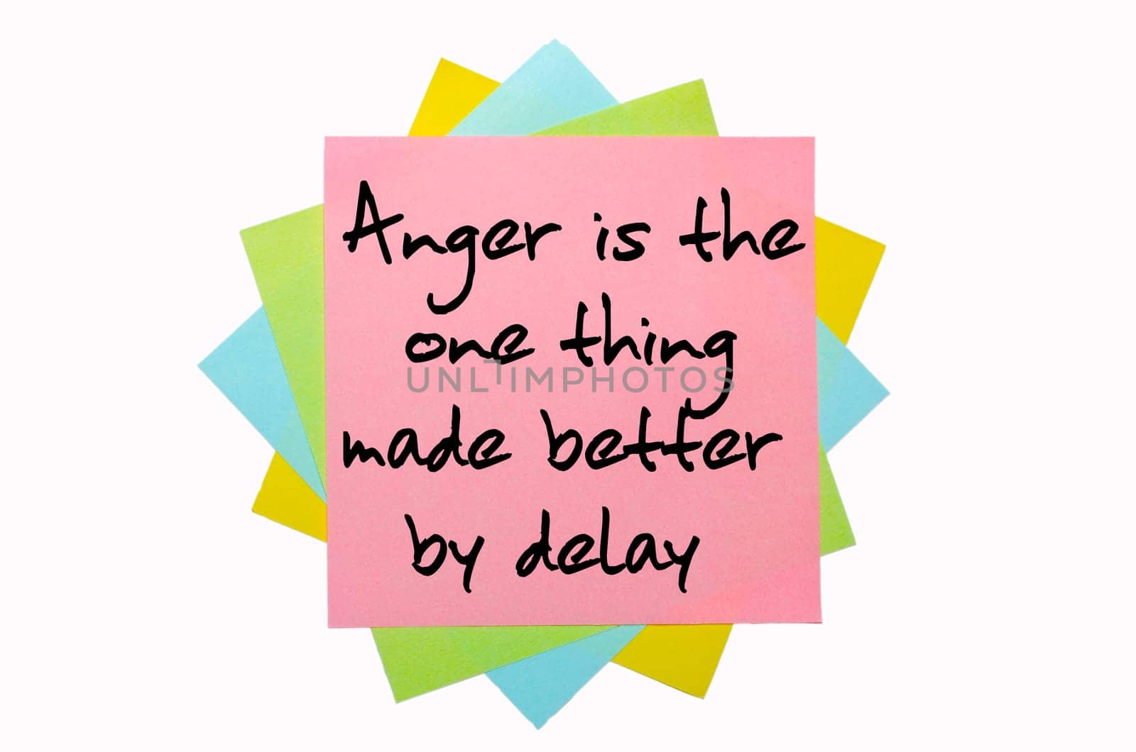 text "Anger is the one thing made better by delay"" written by hand font on bunch of colored sticky notes"