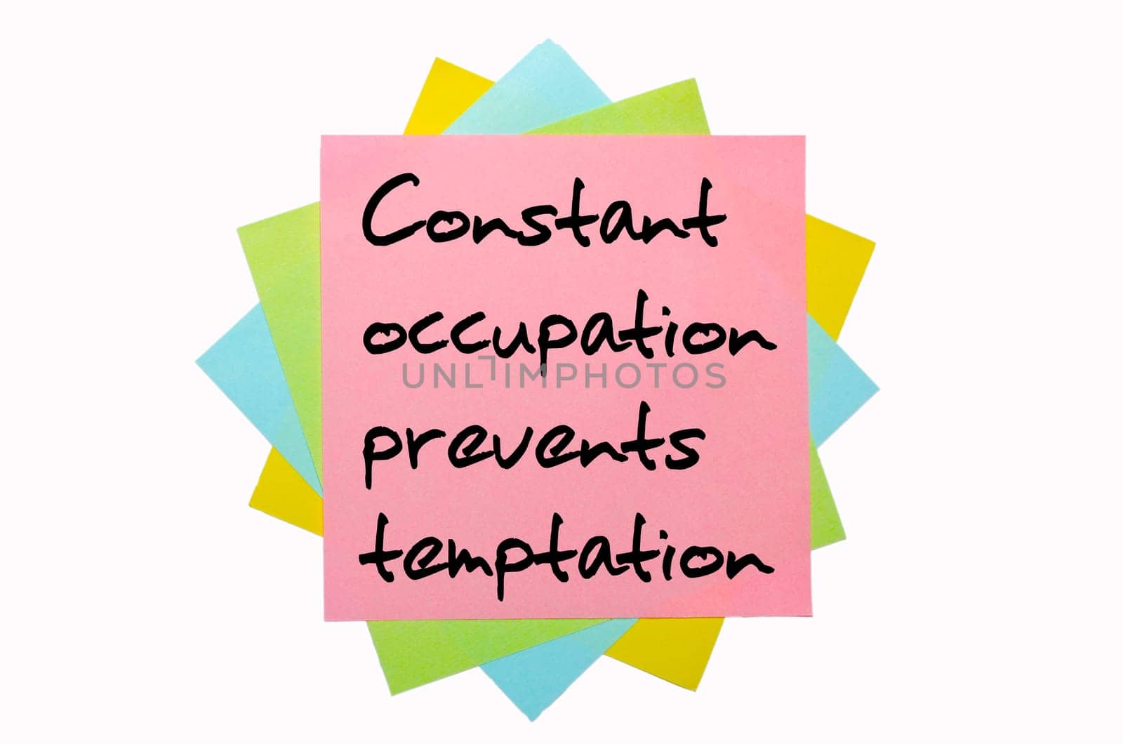 text "Constant occupation prevents temptation"" written by hand font on bunch of colored sticky notes"