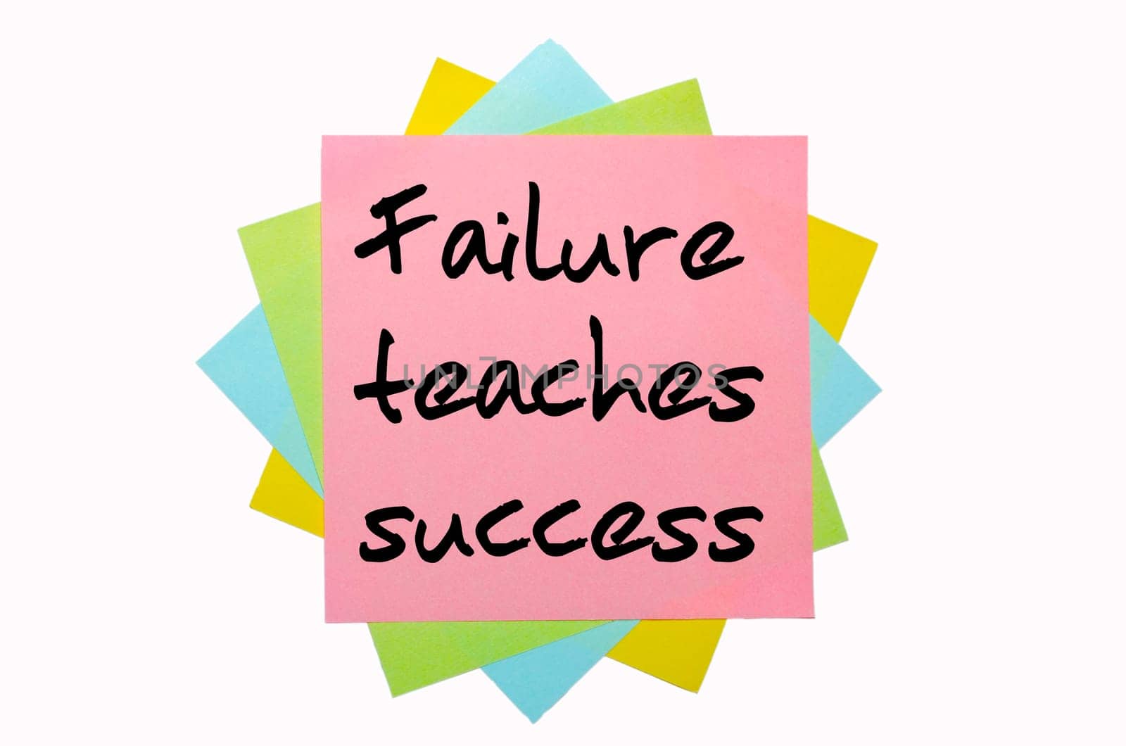 text "  Failure teaches success "" written by hand font on bunch of colored sticky notes"