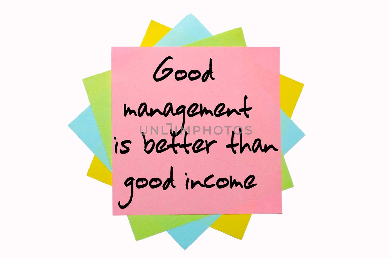 text "  Good management is better than good income "" written by hand font on bunch of colored sticky notes"