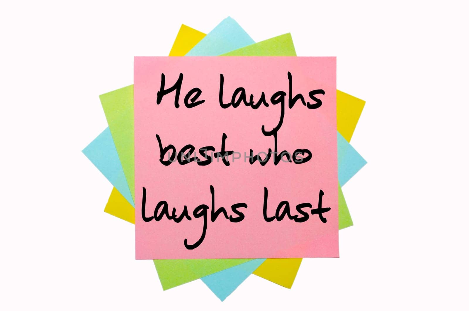 text "  He laughs best who laughs last "" written by hand font on bunch of colored sticky notes"
