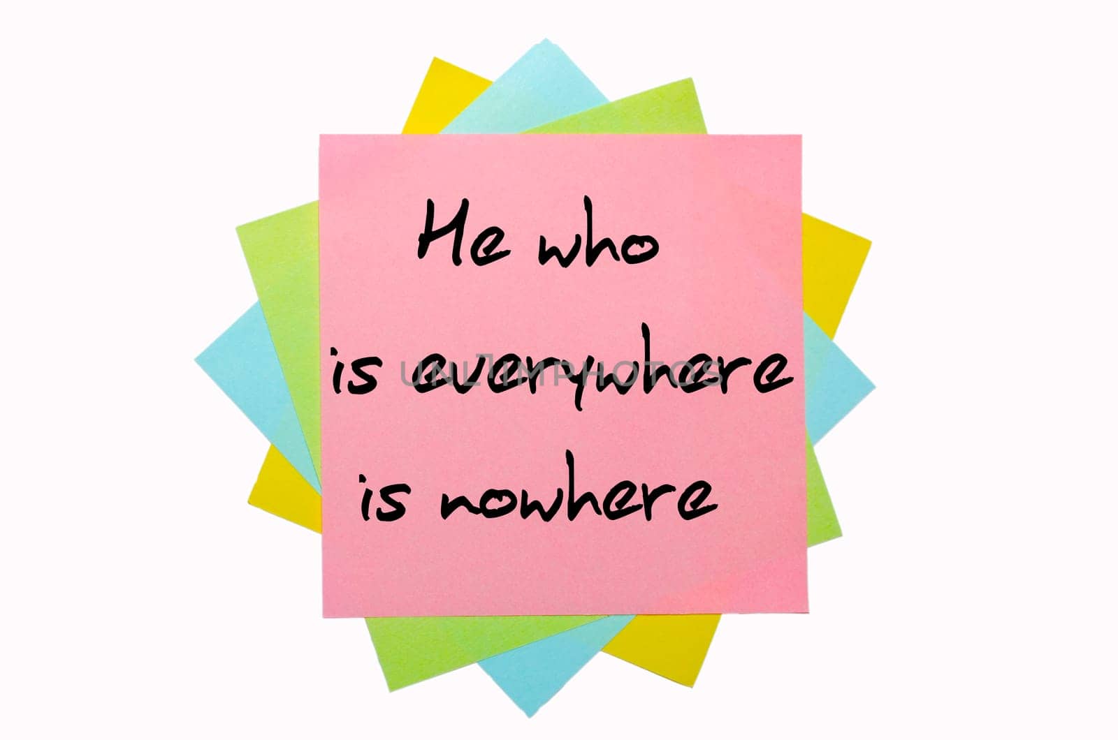 text "  He who is everywhere is nowhere "" written by hand font on bunch of colored sticky notes"