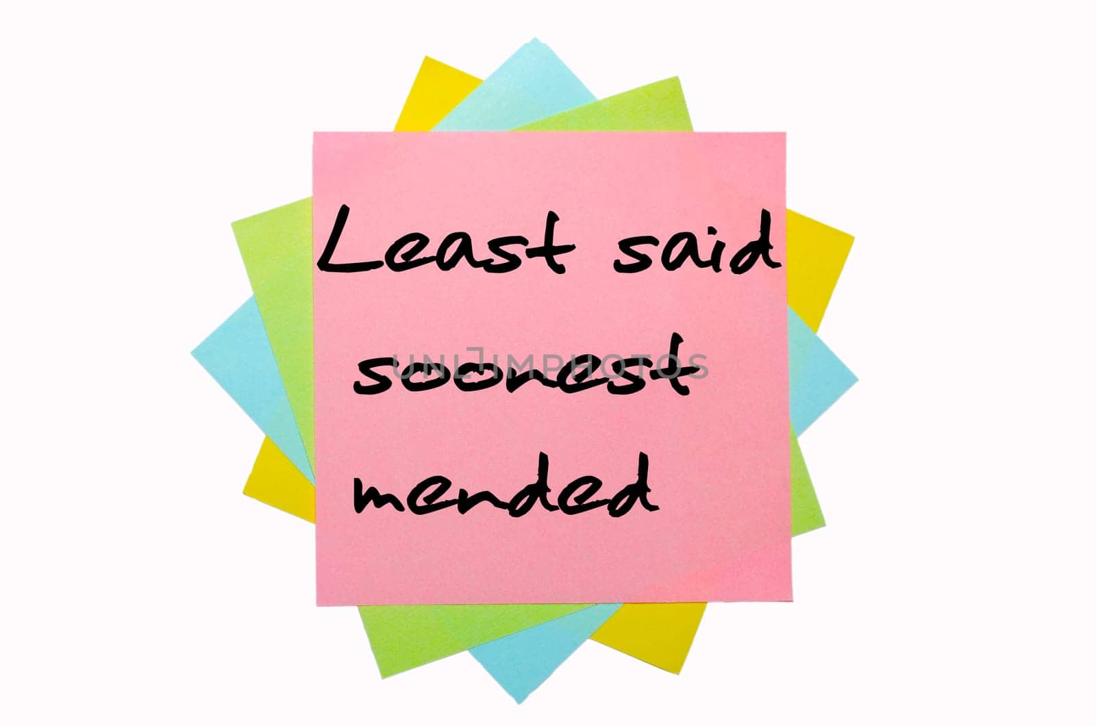 text "Least said soonest mended"" written by hand font on bunch of colored sticky notes"