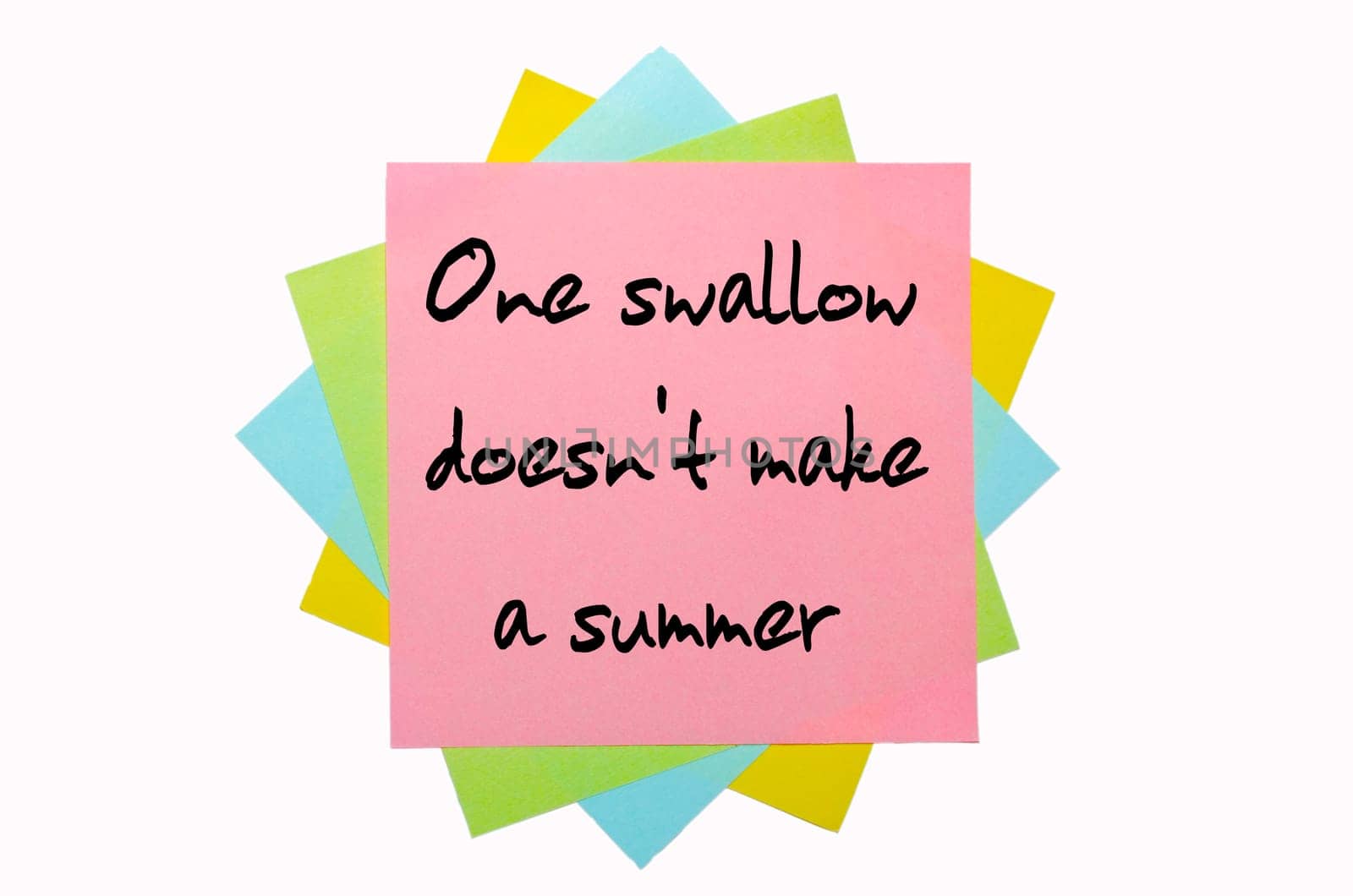 text " One swallow doesn&#039 t make a summer "" written by hand font on bunch of colored sticky notes"