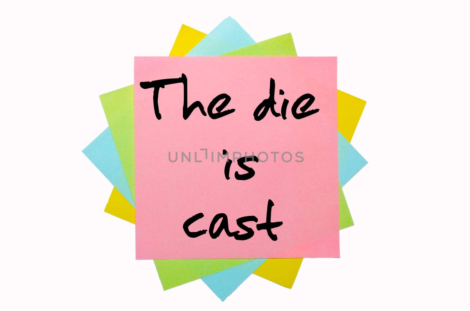 text " The die is cast "" written by hand font on bunch of colored sticky notes"