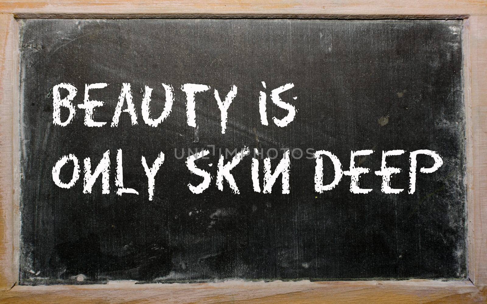 Blackboard writings "Beauty is only skin deep"""