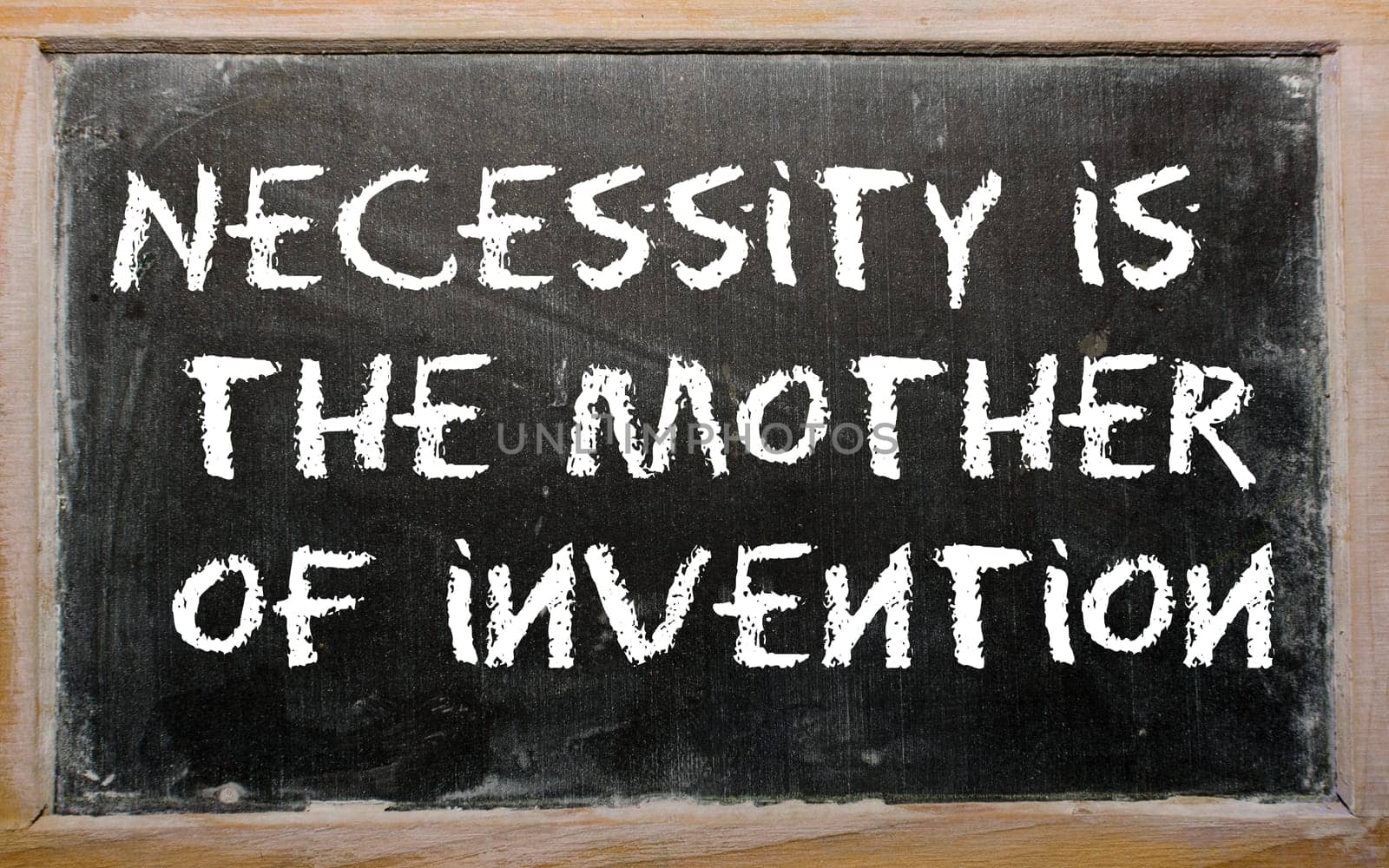 Blackboard writings "Necessity is the mother of invention"""