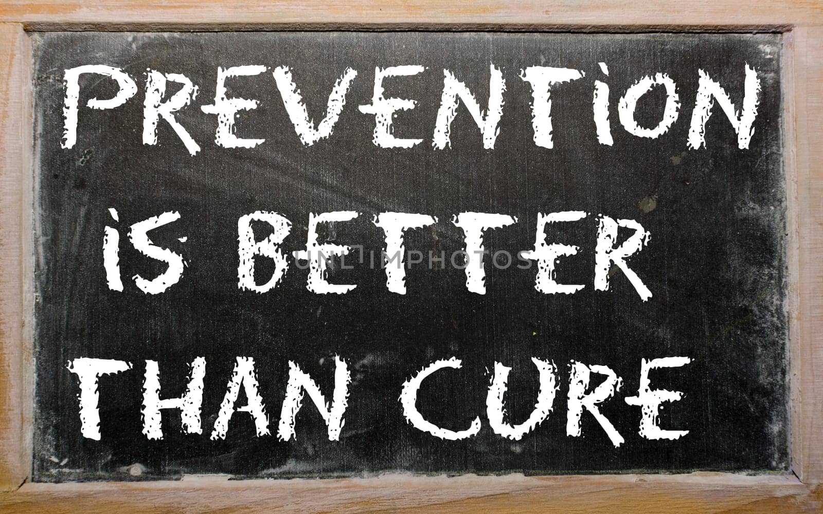 Blackboard writings "Prevention is better than cure"""
