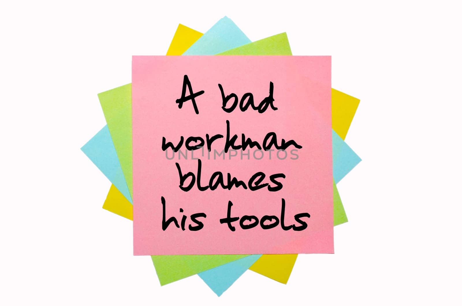 text "A bad workman blames his tools"" written by hand font on bunch of colored sticky notes"