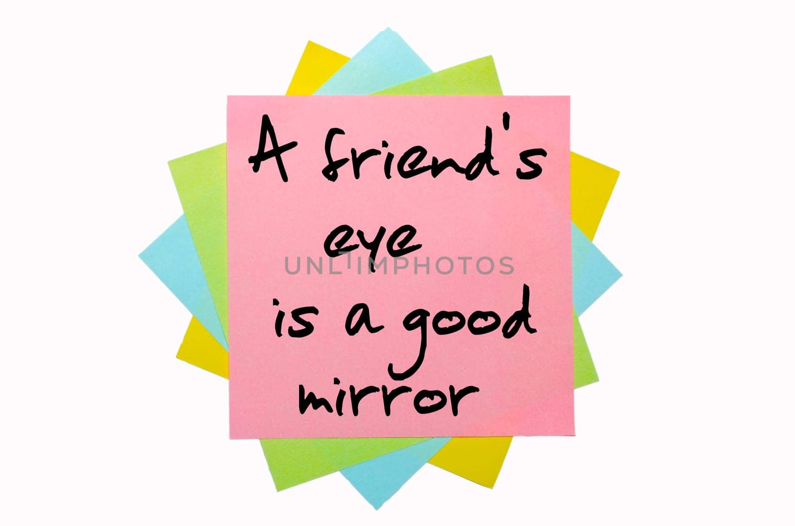 text "A friend&#039 s eye is a good mirror"" written by hand font on bunch of colored sticky notes"