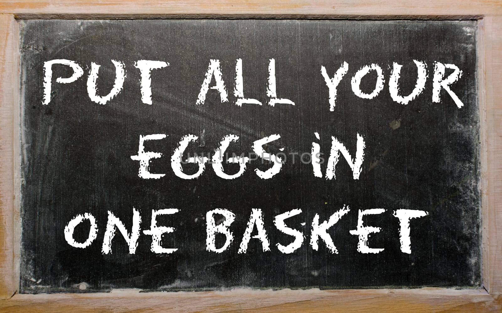 Blackboard writings "Put all your eggs in one basket"""