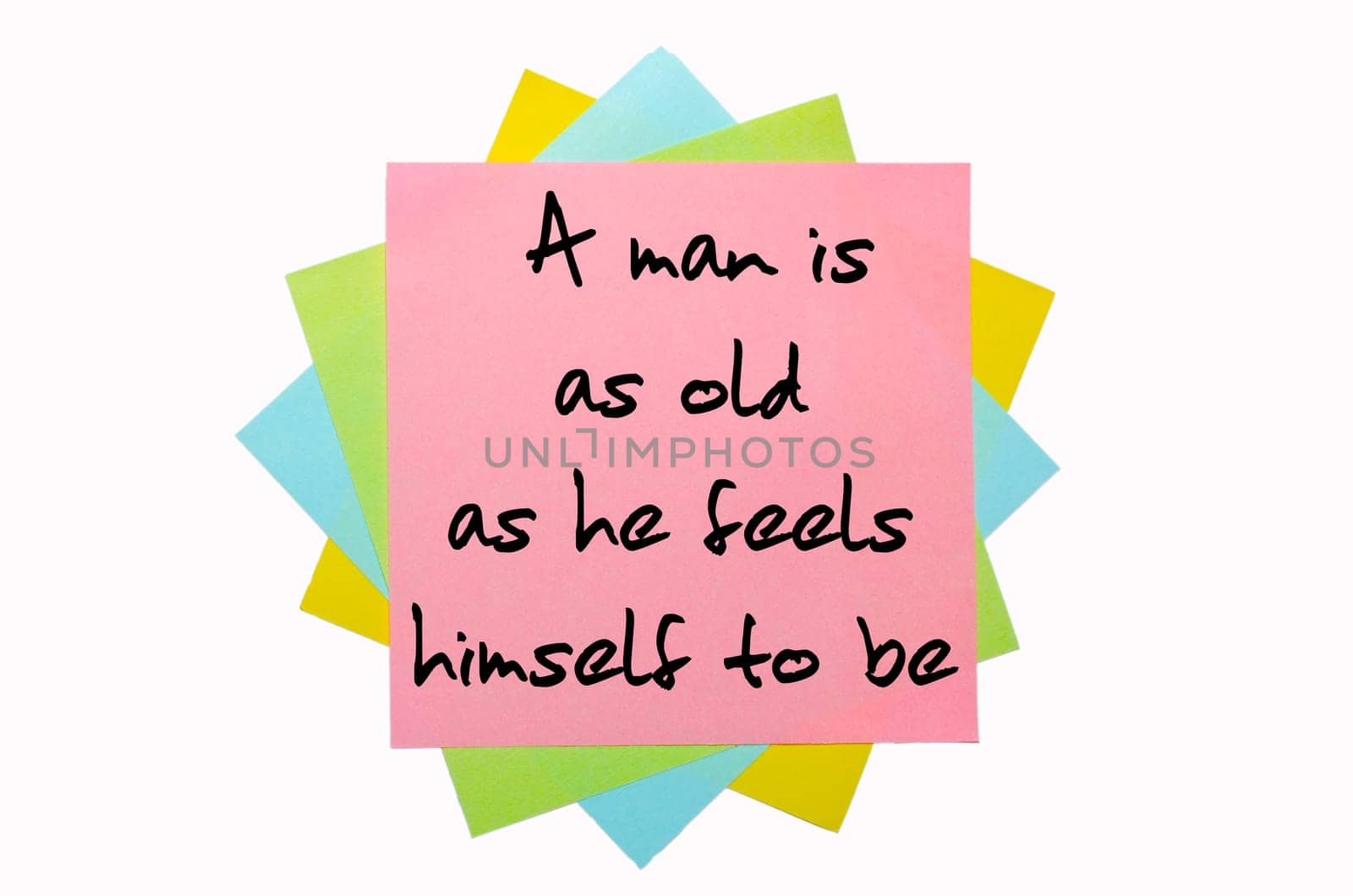 text "A man is as old as he feels himself to be"" written by hand font on bunch of colored sticky notes"