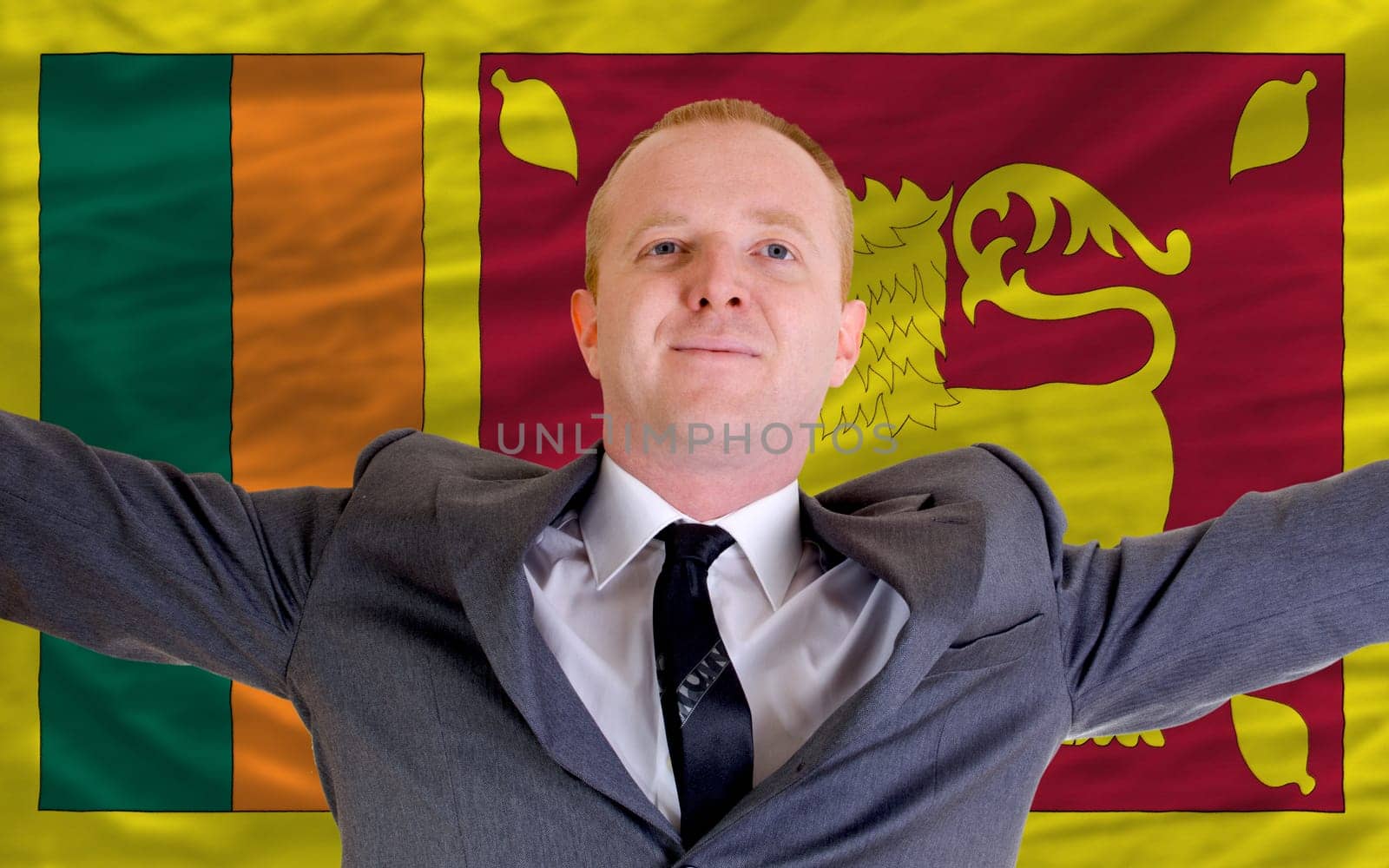 joyful investor spreading arms after good business investment in srilanka, in front of flag