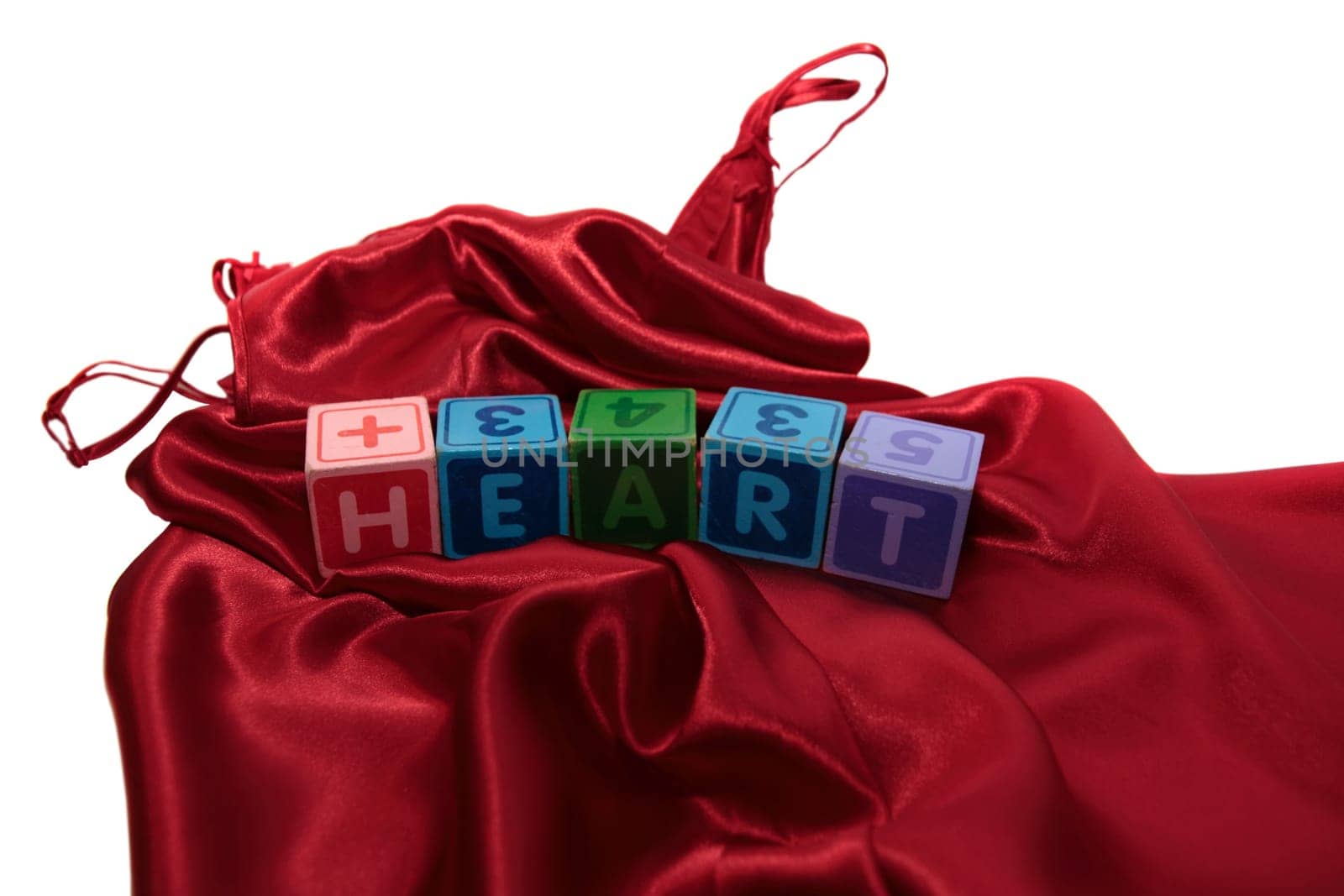 love heart on block on a silk nightie against white background