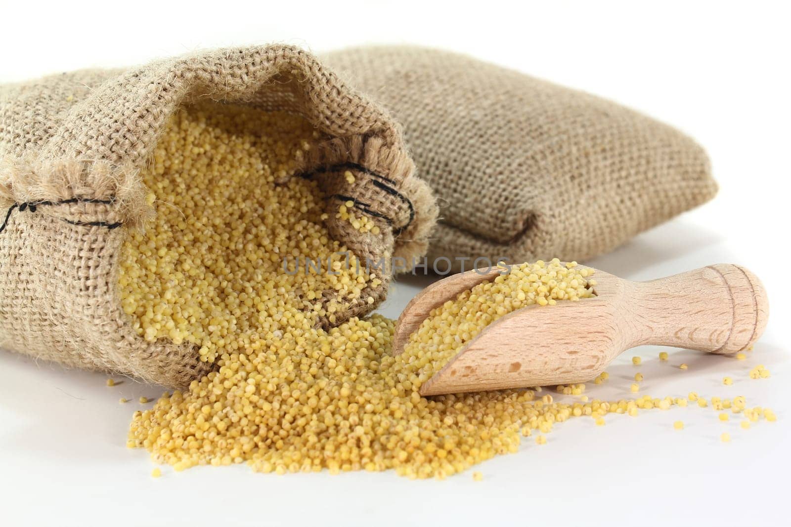 a sack filled with millet against a light background