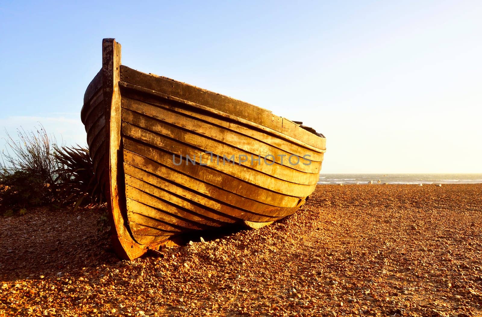 Fisherman barque at sunset on Brighton beach, UK