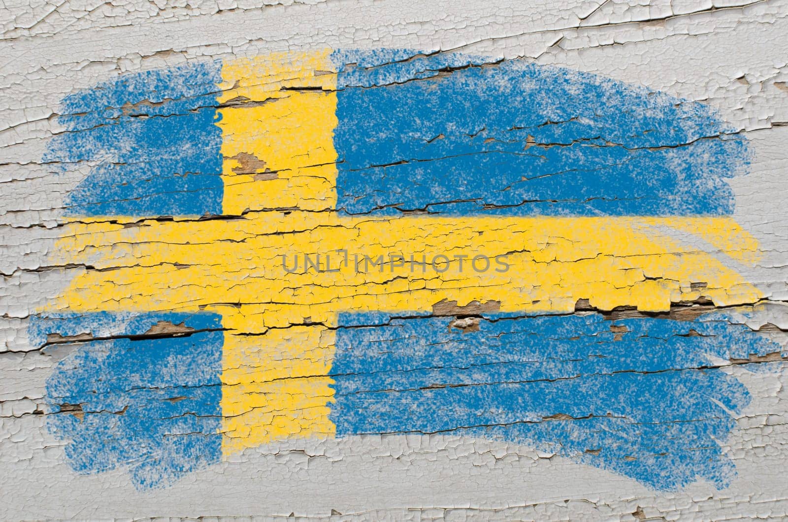 Chalky swedish flag painted with color chalk on grunge wooden texture