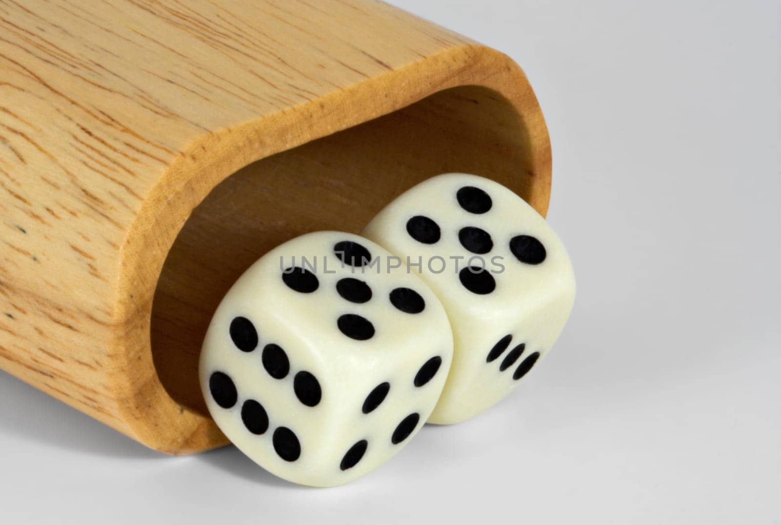 Shaker and dice showing 55