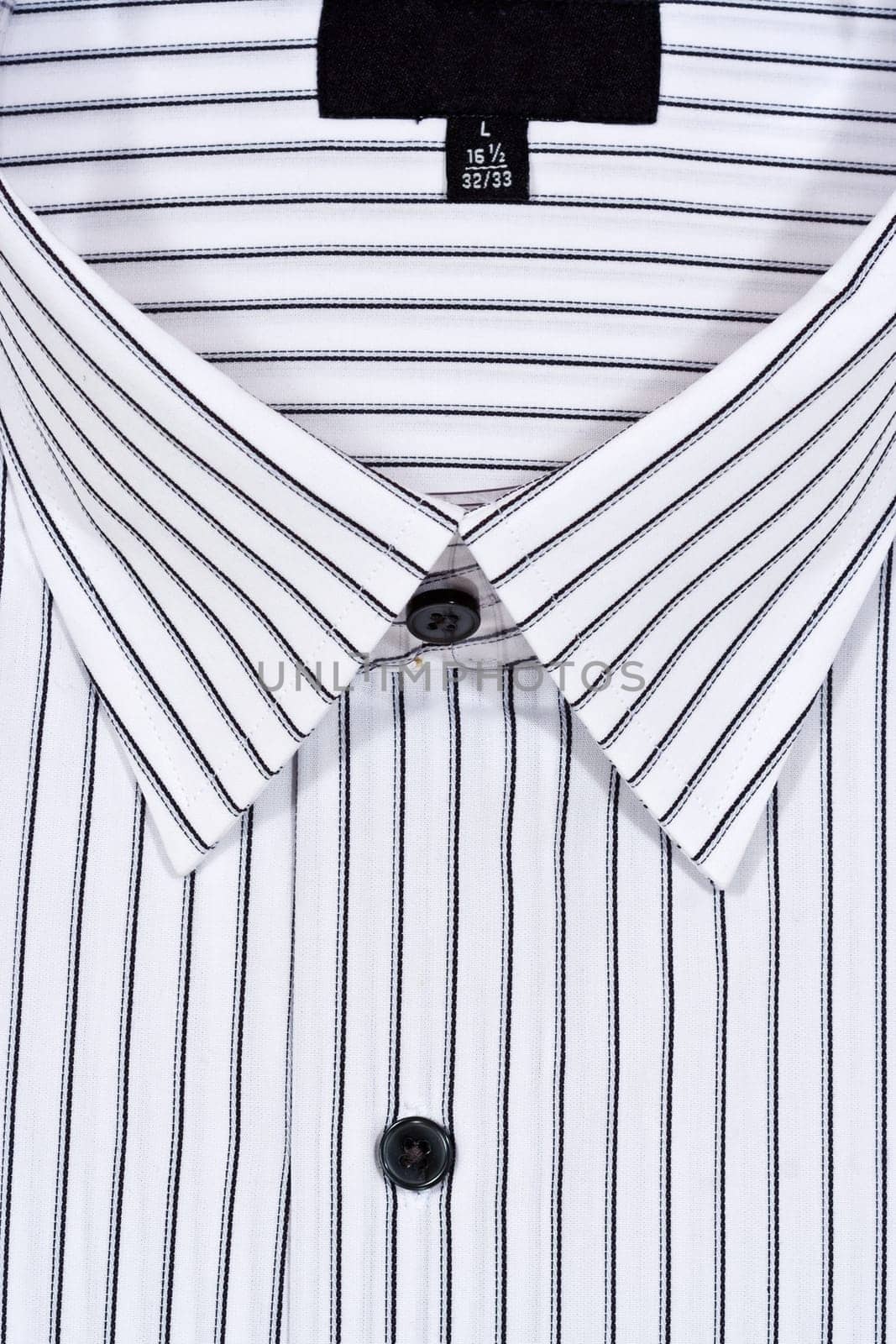Folded white dress shirt filling the entire frame