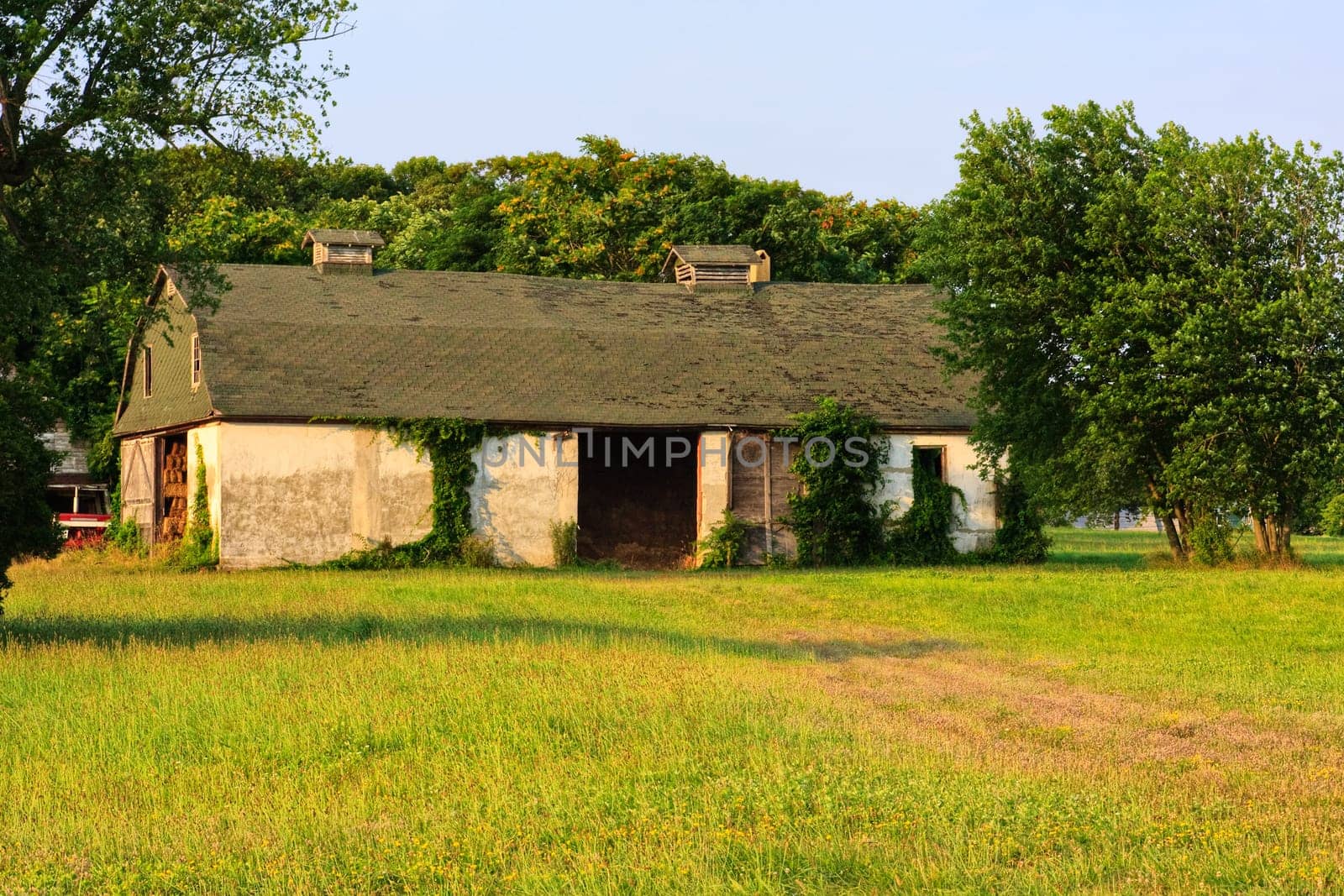A barn in the country captured in late evening sunlight.