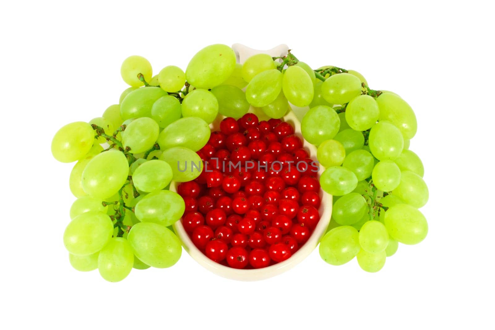 Grape and red currant isolated on white