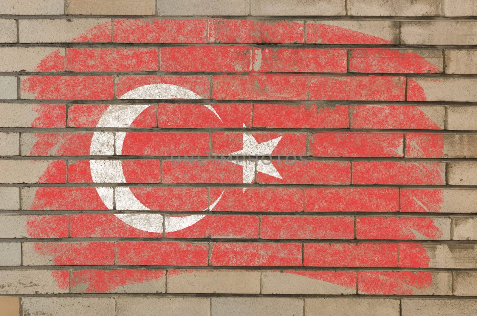 Chalky turkish flag painted with color chalk on grunge old brick wall