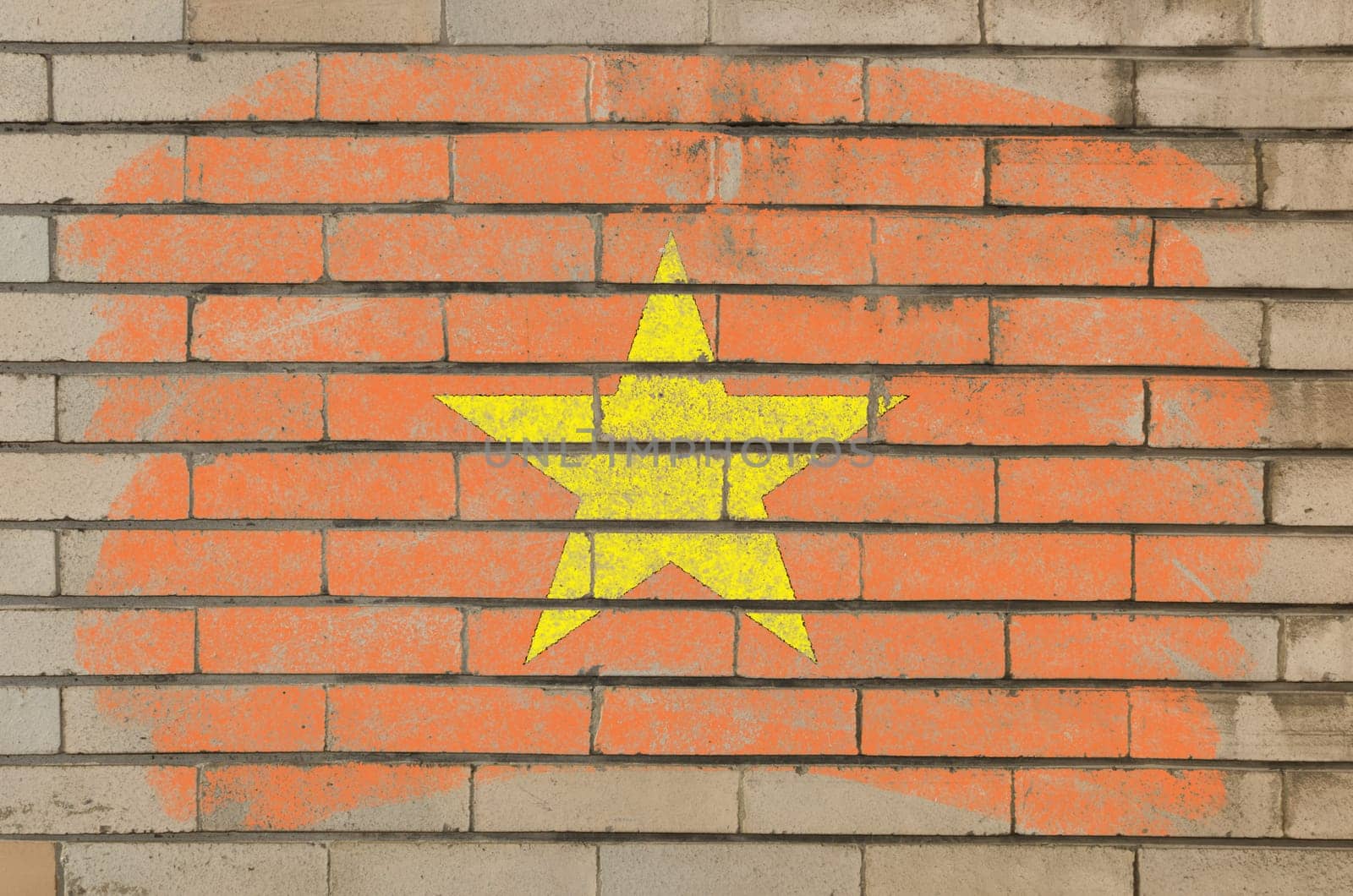 Chalky vietnamese flag painted with color chalk on grunge old brick wall