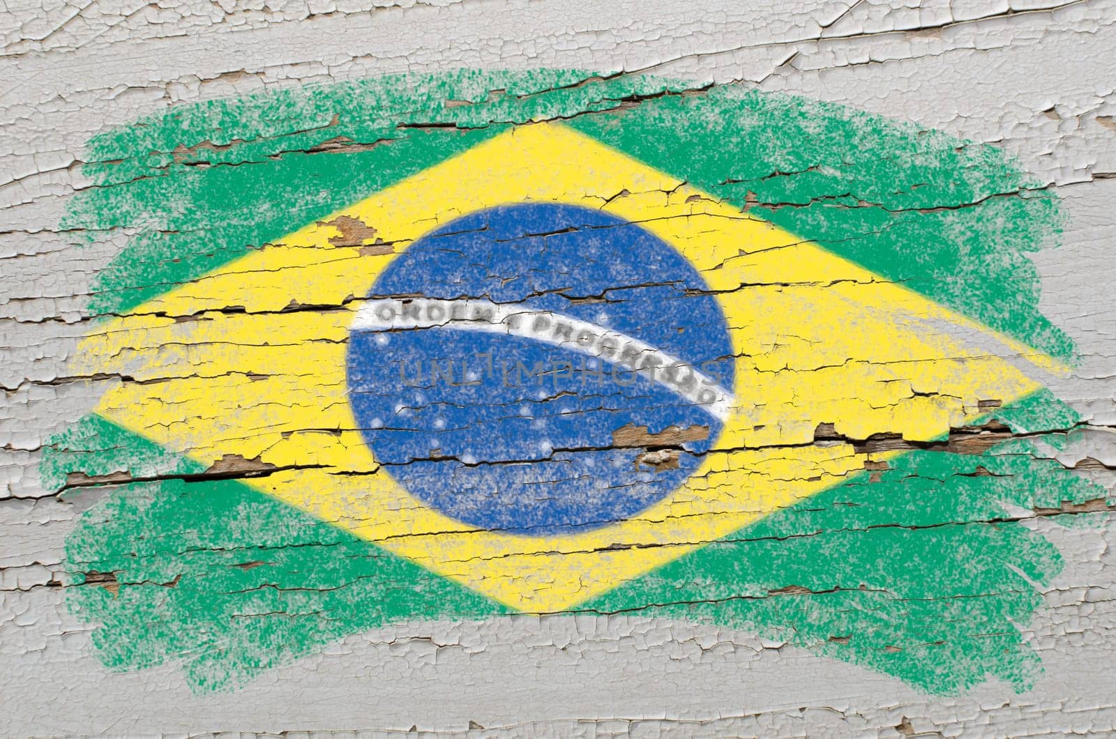 Chalky brazilian flag painted with color chalk on grunge wooden texture