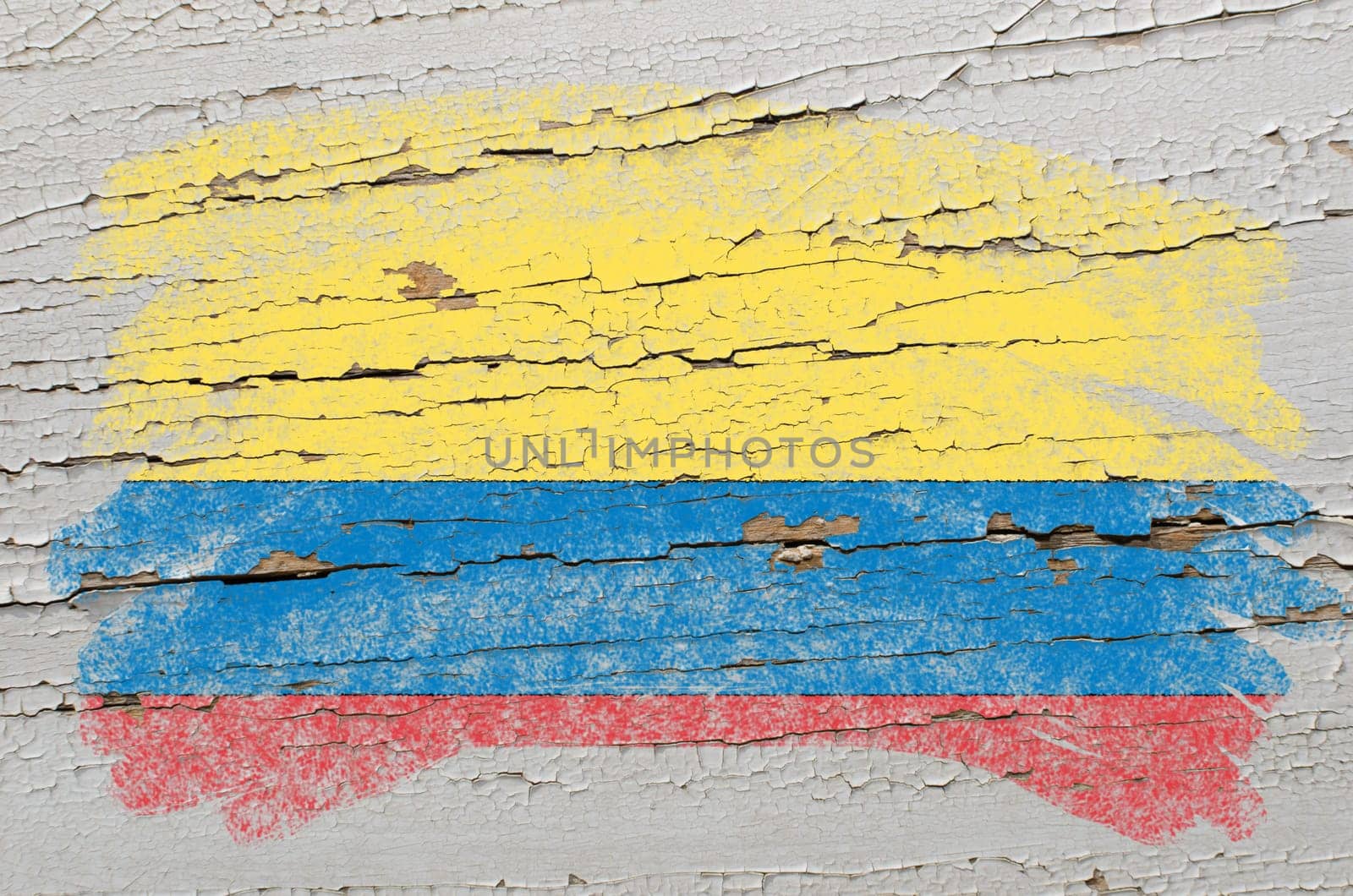 Chalky columbian flag painted with color chalk on grunge wooden texture