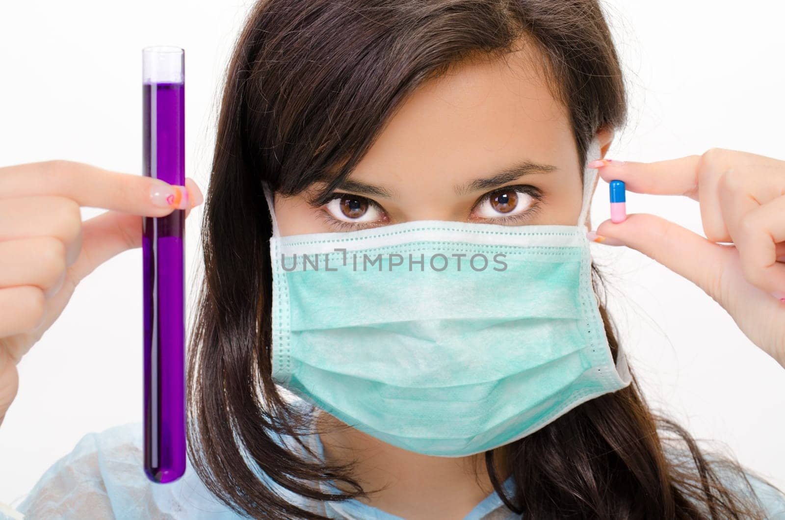 Close-up of glass tube with fluid in chemist hand