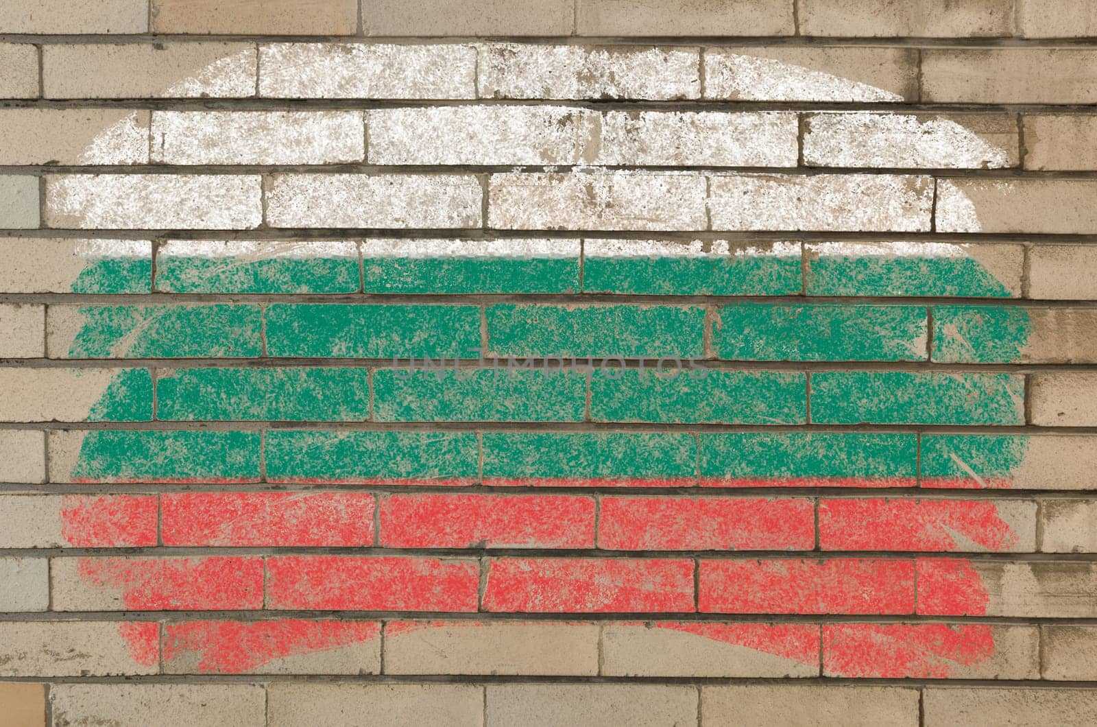 Chalky bulgarian flag painted with color chalk on grunge old brick wall