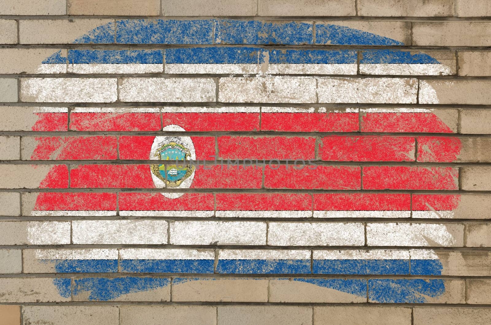 Chalky costa rica flag painted with color chalk on grunge old brick wall