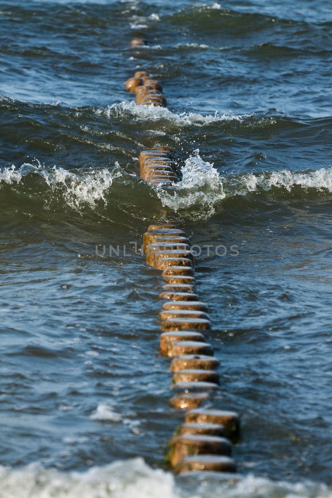 Breakwater made of logs in the Baltic Sea