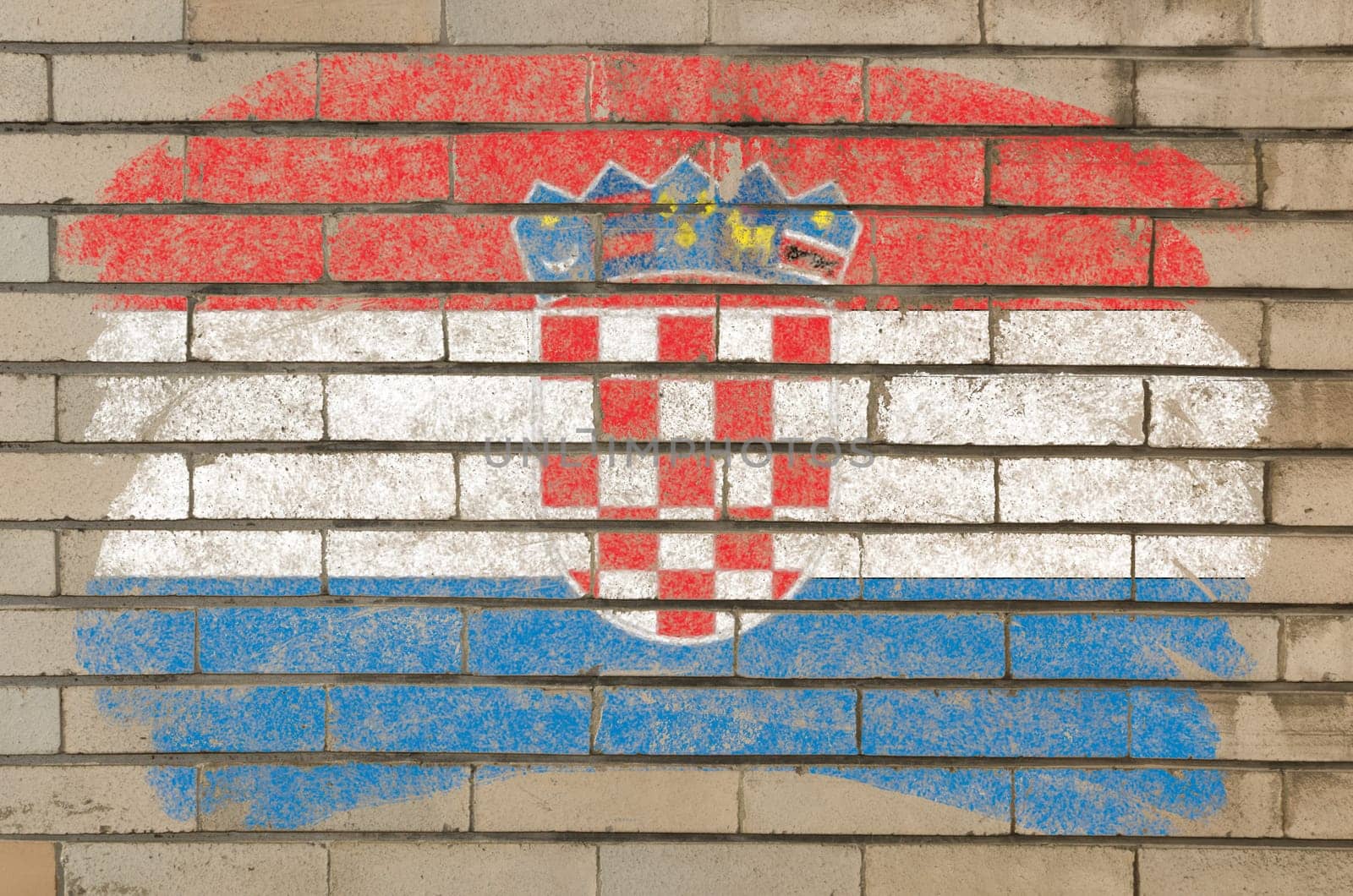 Chalky croatian flag painted with color chalk on grunge old brick wall