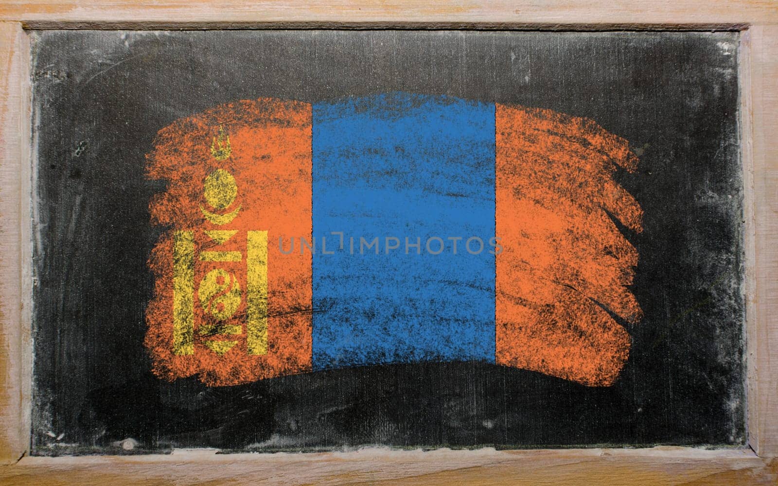 Chalky mongolian flag painted with color chalk on old blackboard