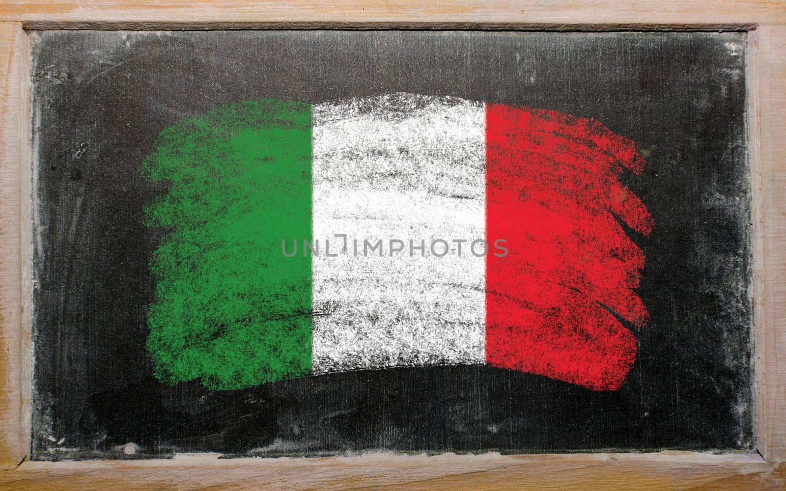 Chalky Italian flag painted with color chalk on old blackboard