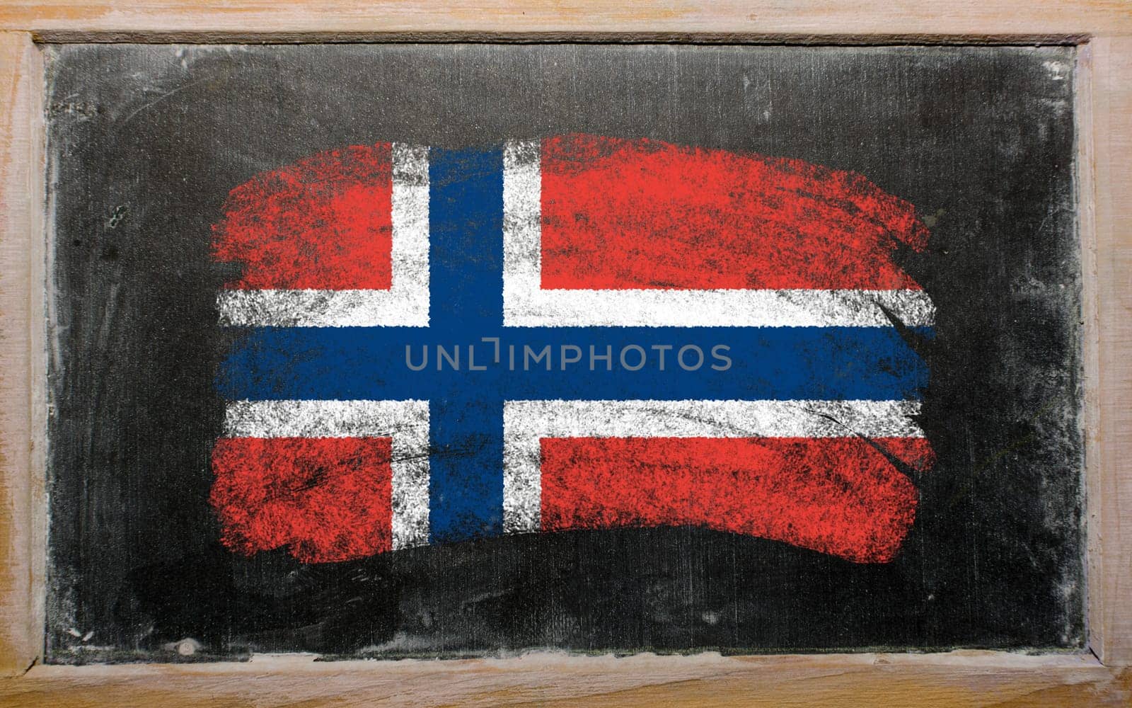 Chalky norwegian flag painted with color chalk on old blackboard