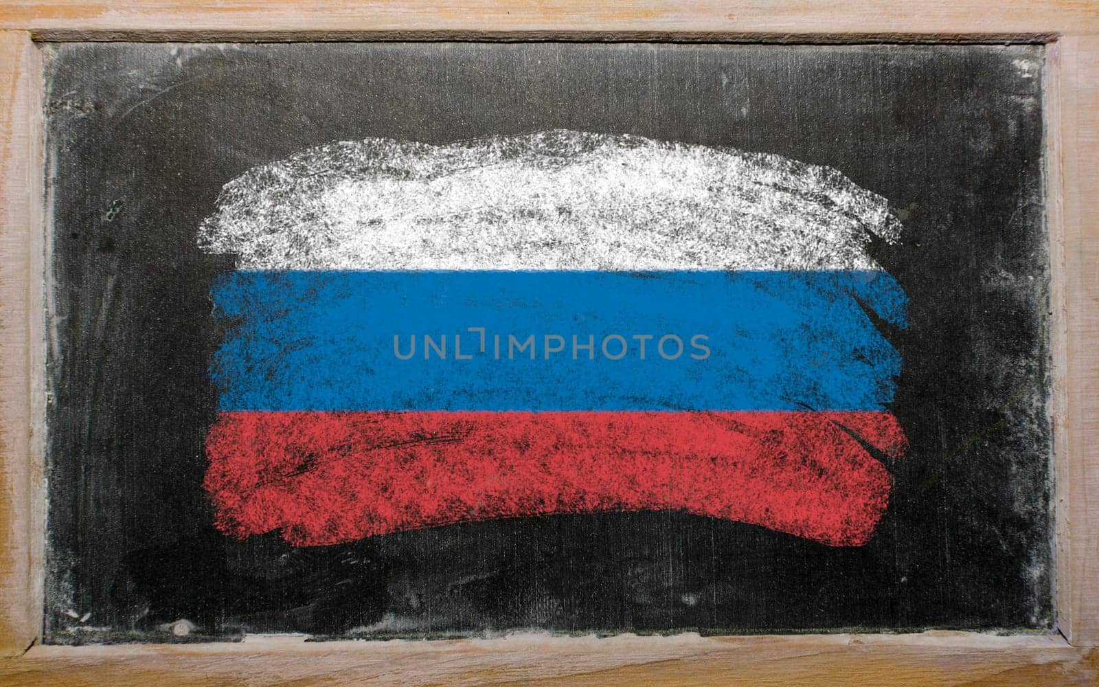 Chalky russian flag painted with color chalk on old blackboard