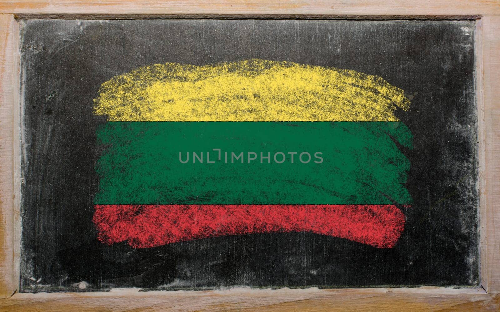 Chalky lithuanian flag painted with color chalk on old blackboard