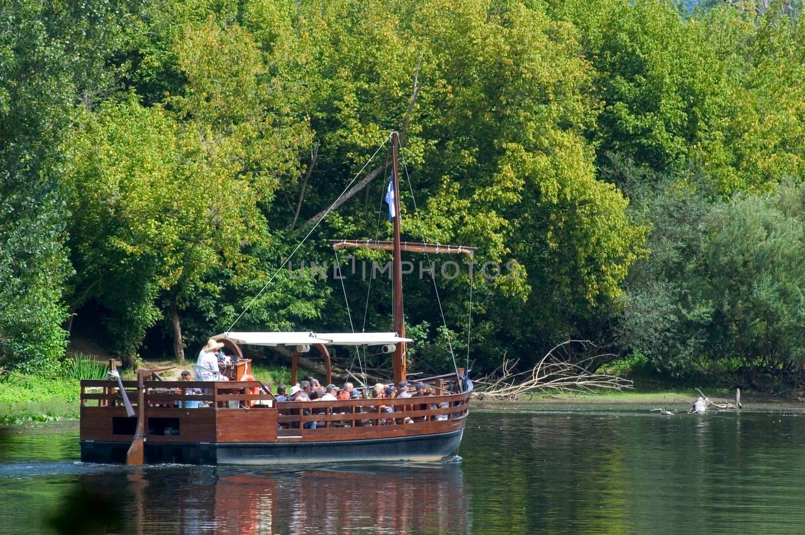 A walk in boat on the Dordogne on board traditional boatscalled barges or gabarres