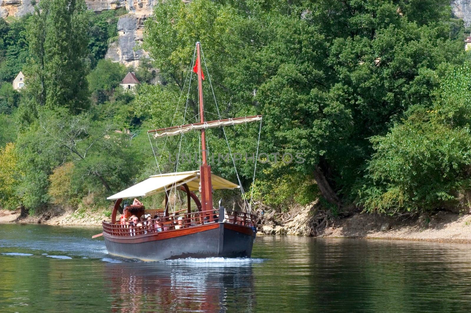 A walk in boat on the Dordogne on board traditional boatscalled barges or gabarres